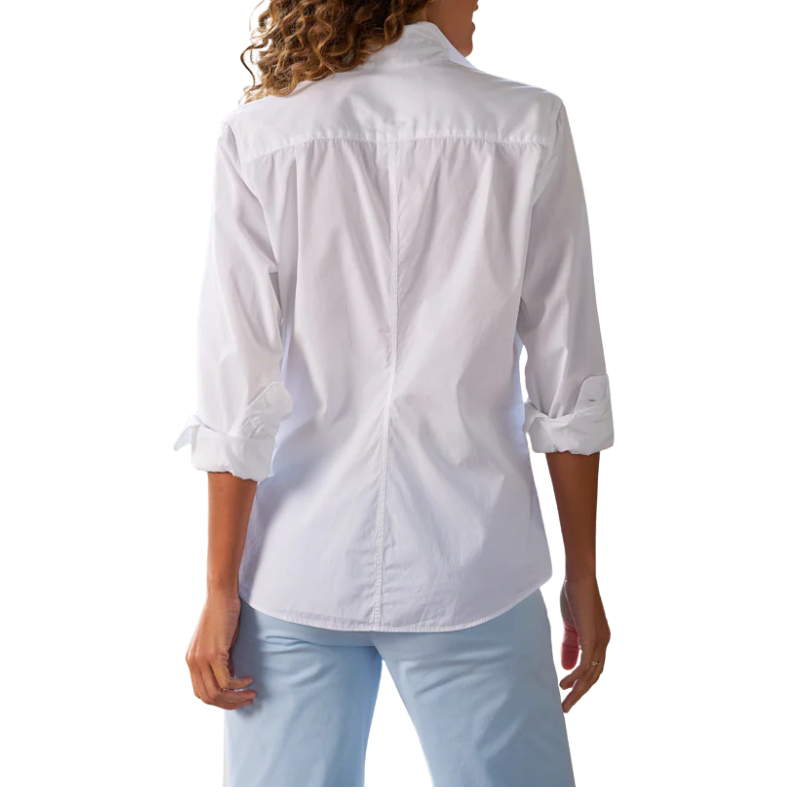 White button-up shirt worn by a person on a white background