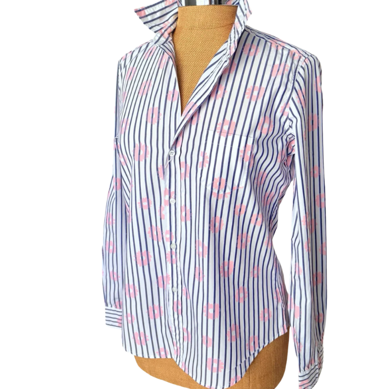 Striped shirt with pink floral pattern on a mannequin against a white background