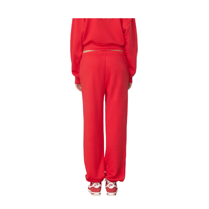 Red tracksuit worn by a person on a white background
