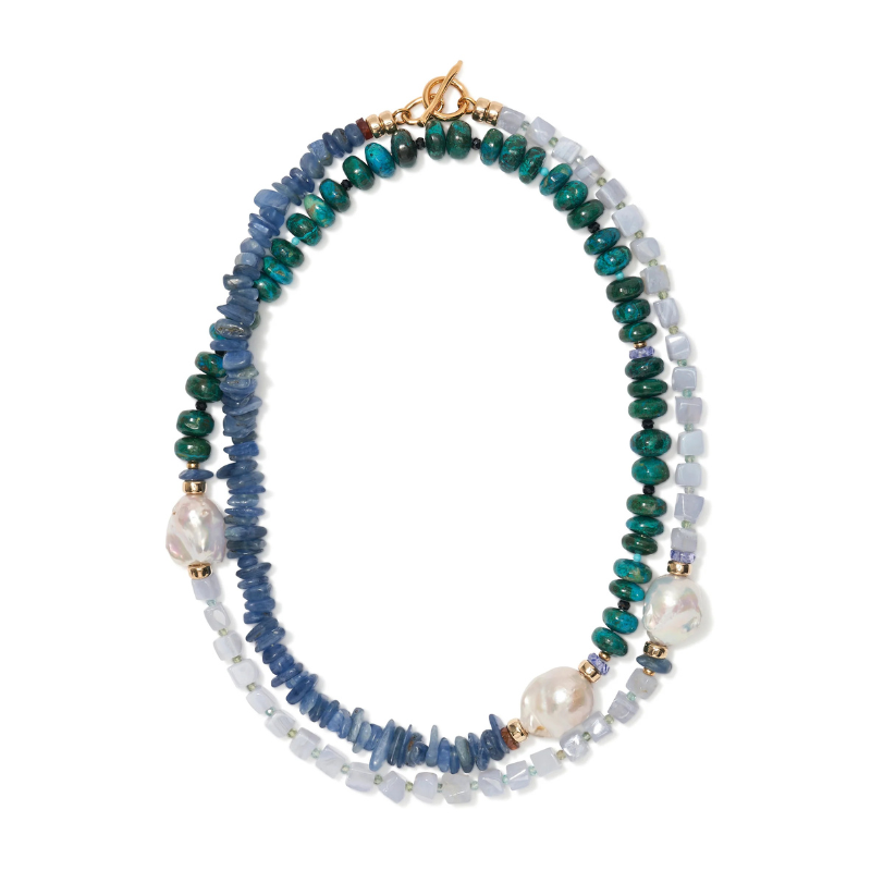 Multicolored beaded necklace with pearls on a white background