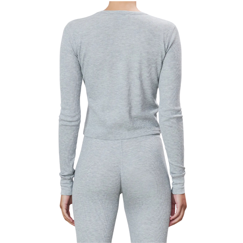 Gray long-sleeve top and pants set on a white background