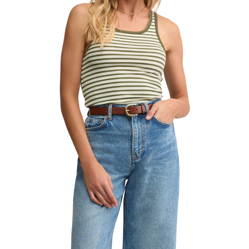 Person wearing a striped tank top and blue jeans on a white background