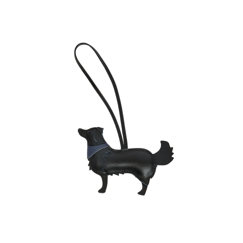 Black dog-shaped keychain with a gray strap on a white background