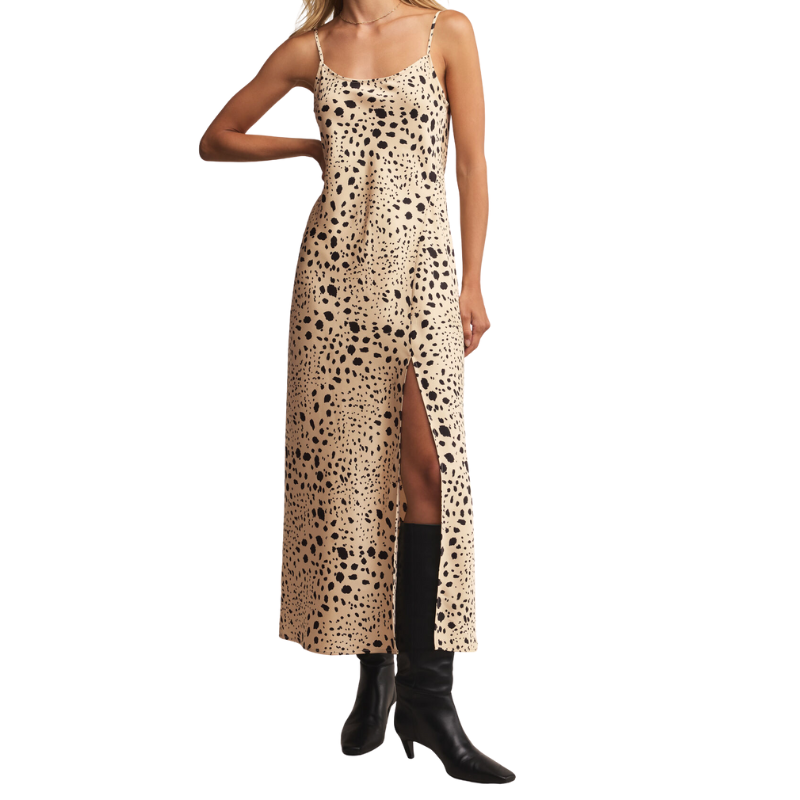 Woman wearing a leopard print dress with a white background