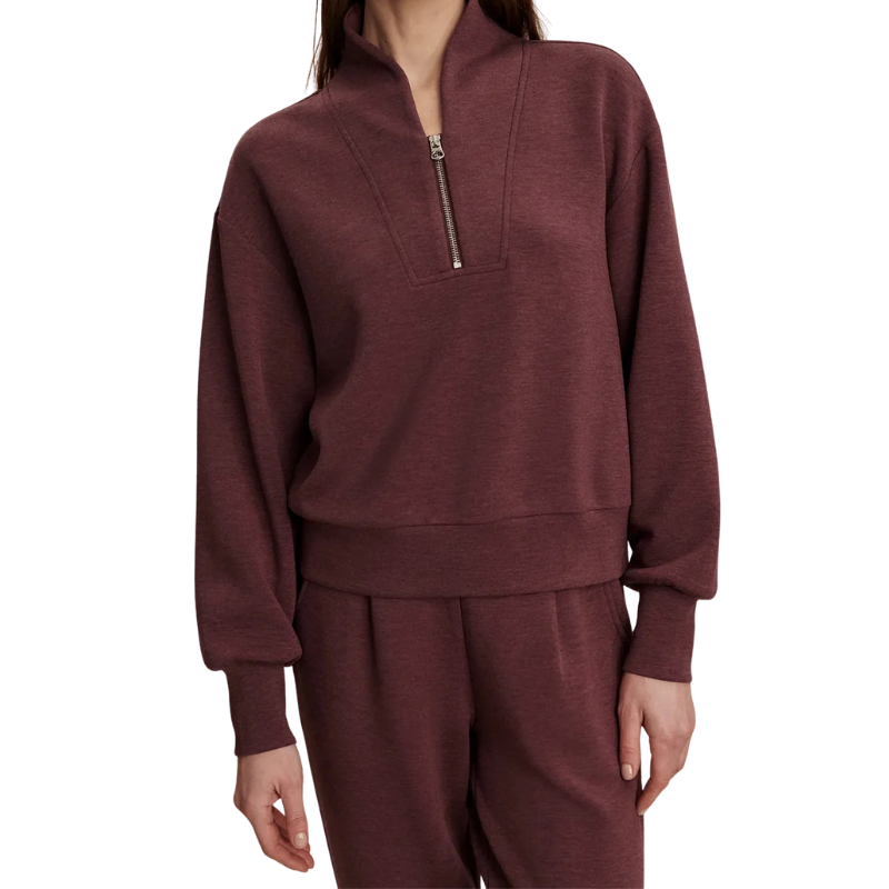 Maroon tracksuit with a quarter zip on a white background