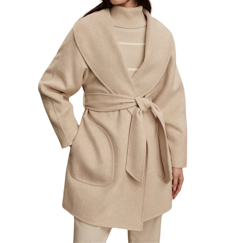Beige wrap coat worn by a person on a white background