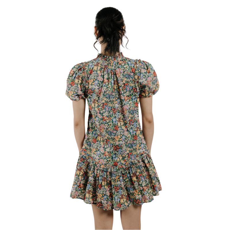 Floral dress worn by a person on a white background