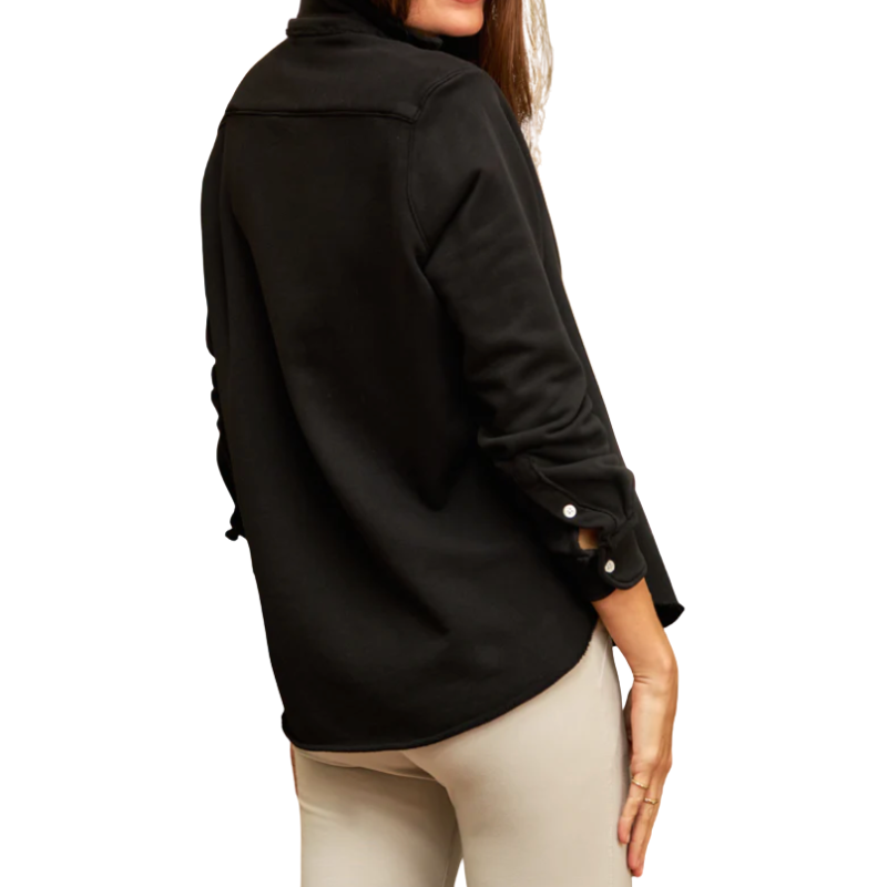 Person wearing a black jacket with rolled-up sleeves on a white background