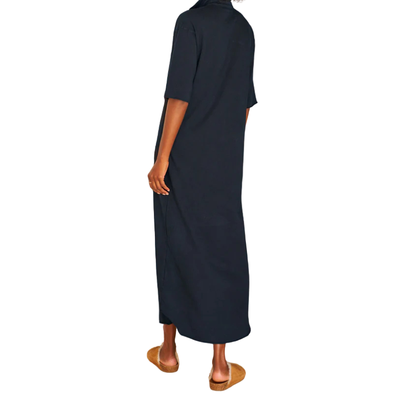 Person wearing a long navy dress on a white background