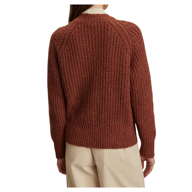 Brown knitted sweater worn by a person on a white background