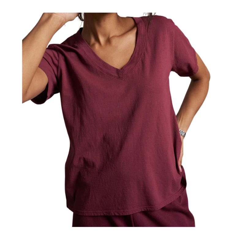 Maroon top worn by a person on a white background