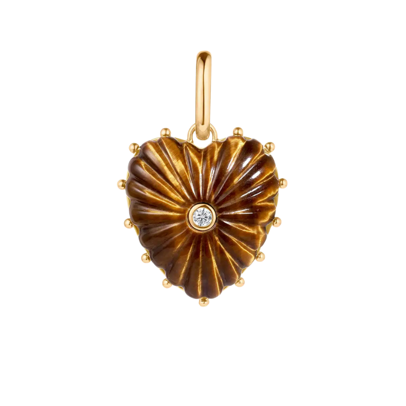 Heart-shaped pendant with gold border and central gemstone on a white background