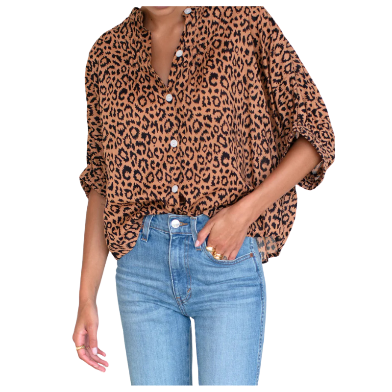 Leopard print blouse worn by a person on a white background