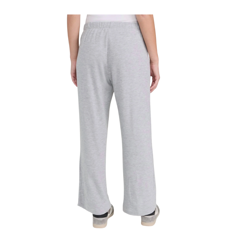 Gray sweatpants worn by a person on a white background