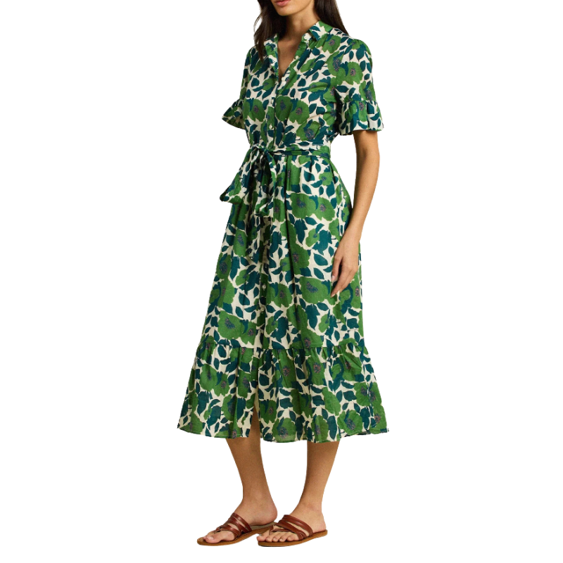 Woman wearing a green floral dress on a white background