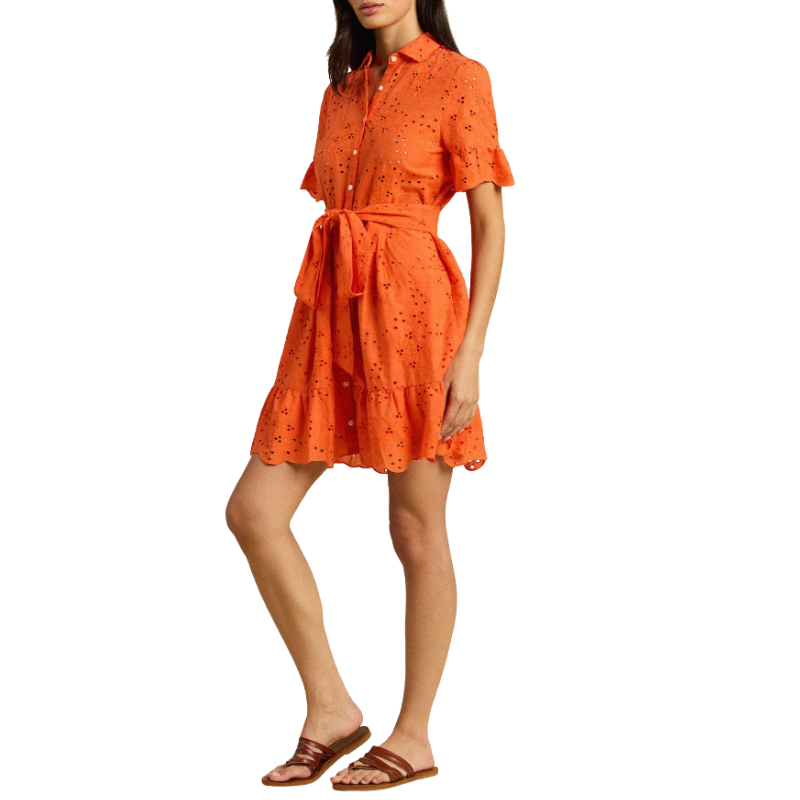 Woman wearing an orange dress with a white background