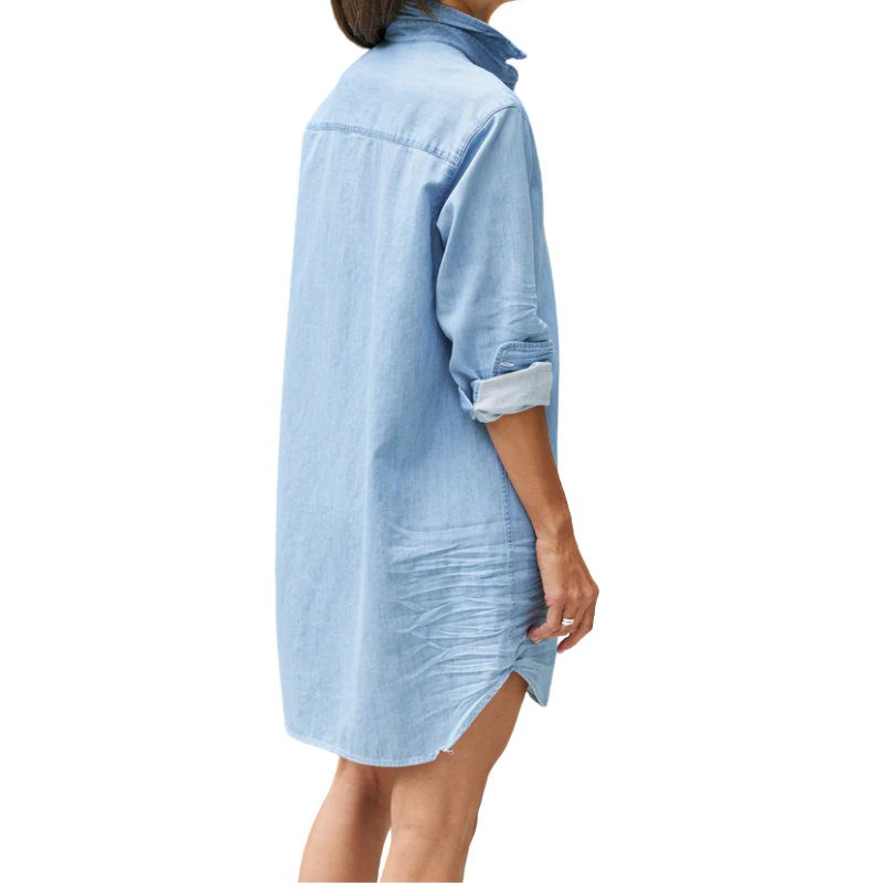 Light blue denim shirt worn by a person on a white background