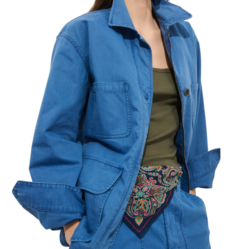 Blue jacket with a colorful patterned scarf draped over the shoulder on a white background