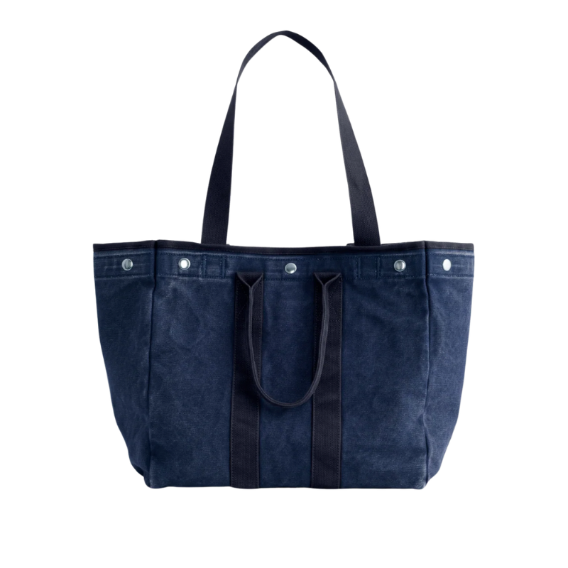 Blue tote bag with black handles on a white background