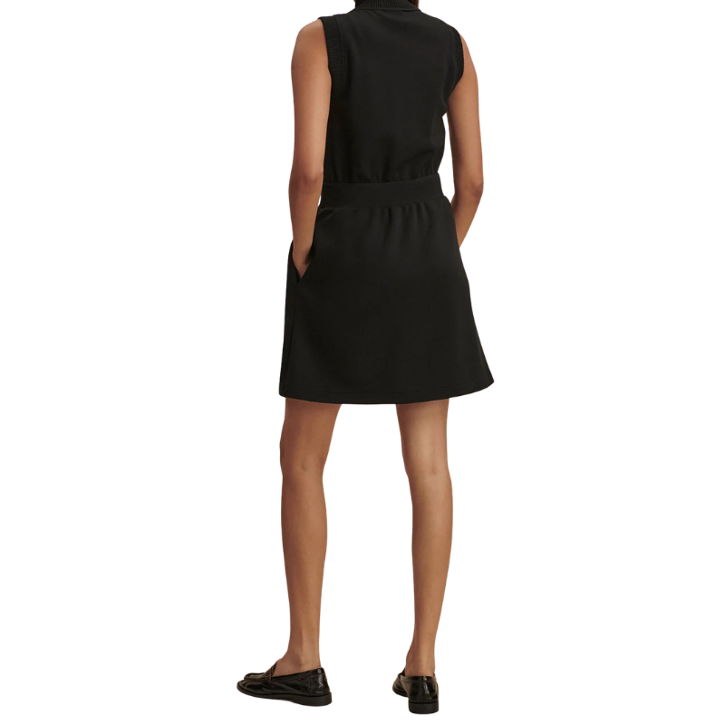 Black sleeveless dress worn by a person on a white background