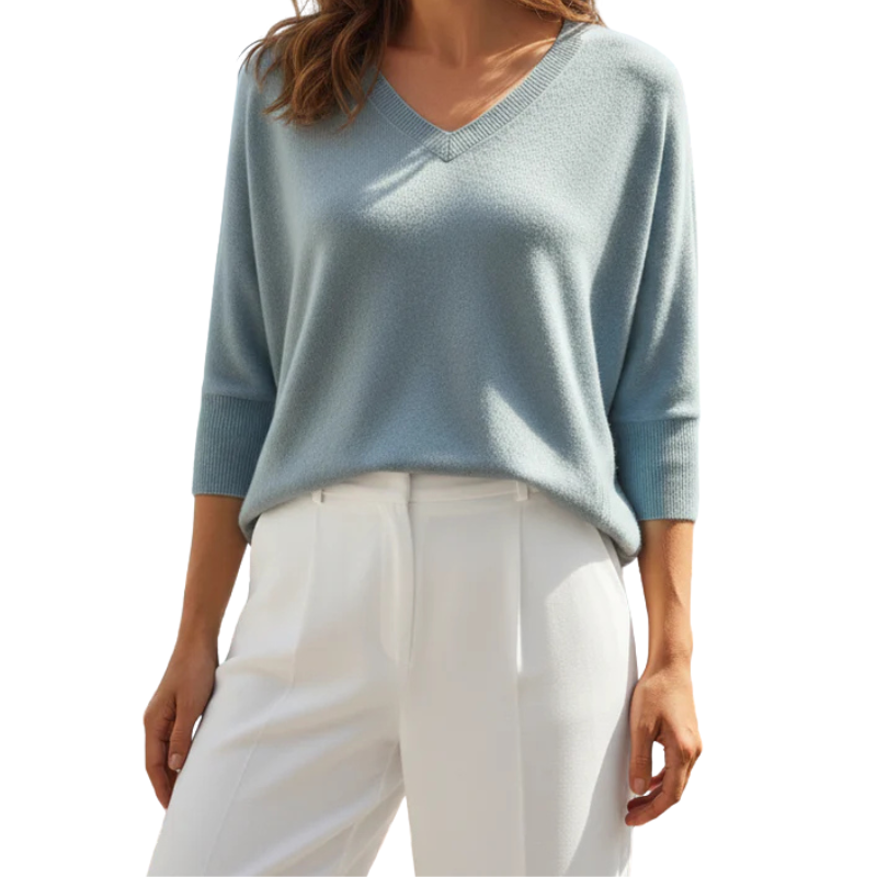 Light blue sweater worn by a person on a white background