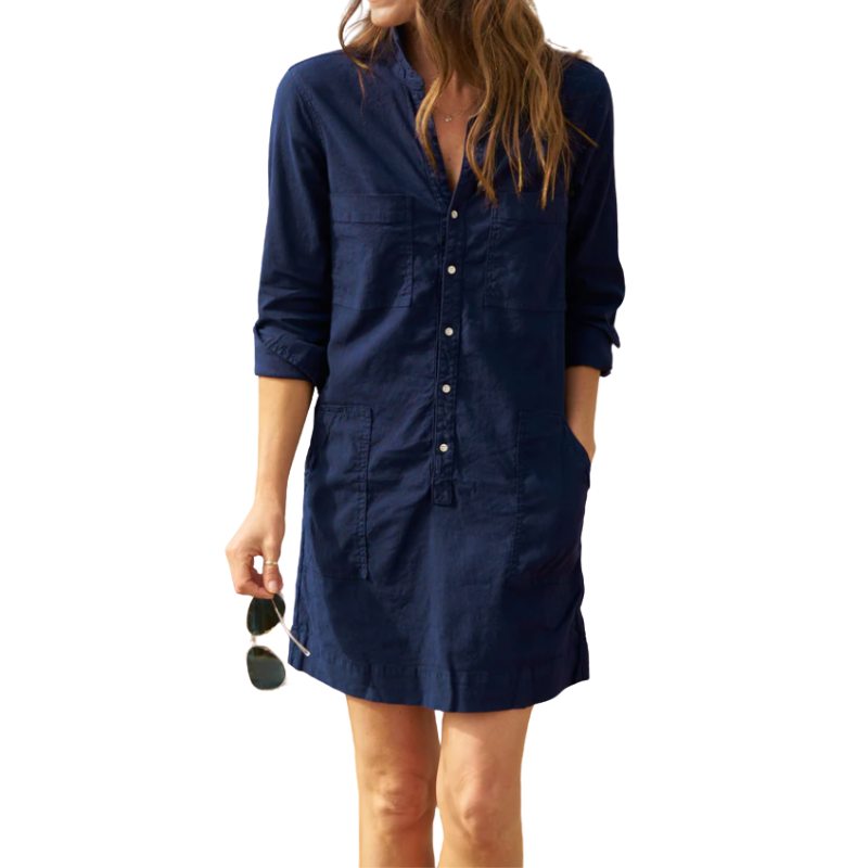 Woman wearing a navy blue dress on a white background