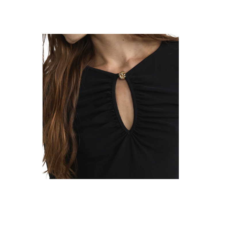 Black top with a cut-out design on a white background