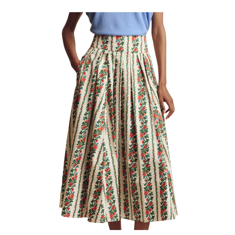 Person wearing a floral skirt on a white background