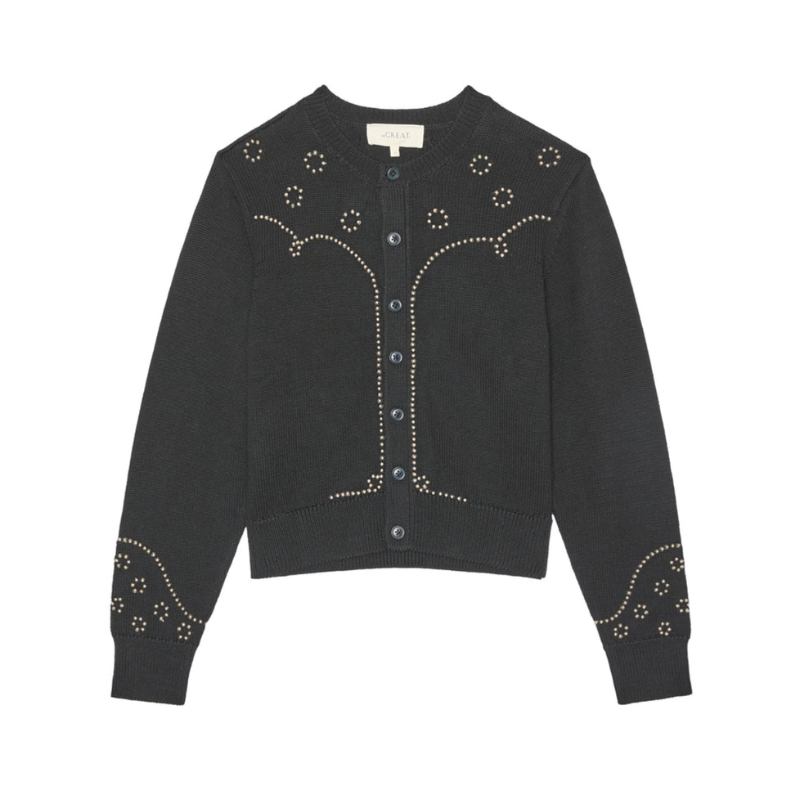 Black cardigan with decorative buttons and patterns on a white background