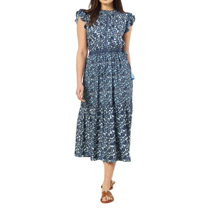 Woman wearing a blue floral dress on a white background