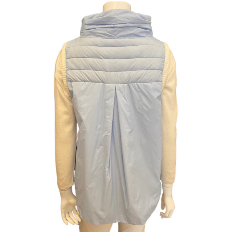 Light gray puffer vest over a beige shirt on a mannequin against a white background