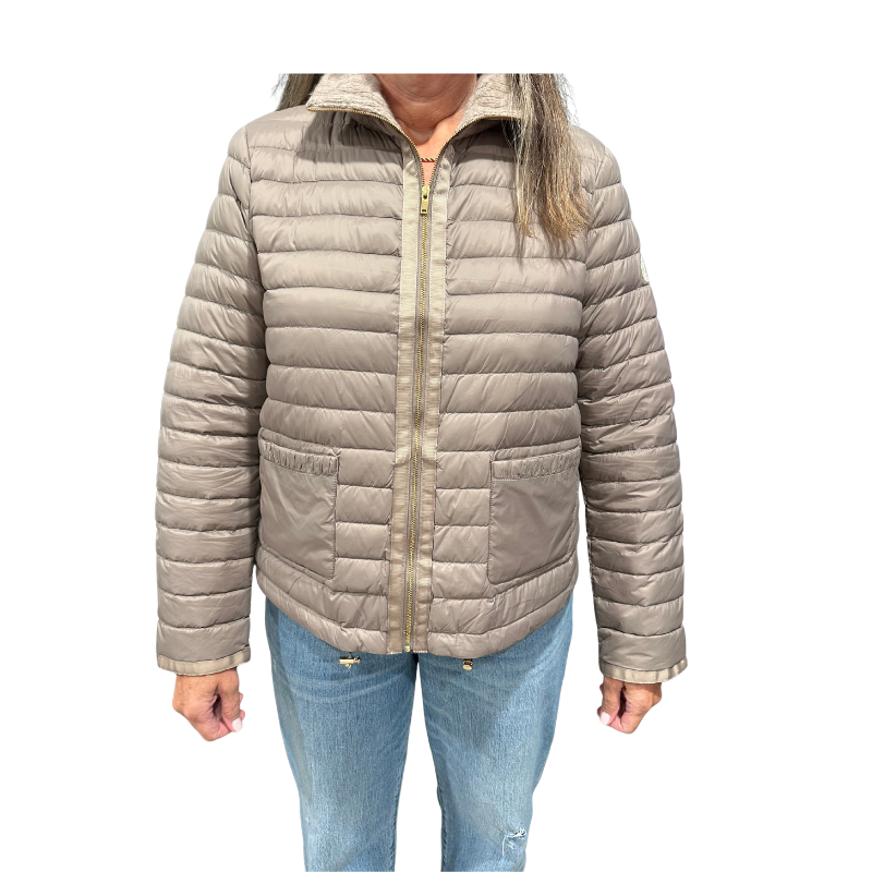 Beige puffer jacket worn by a person on a white background