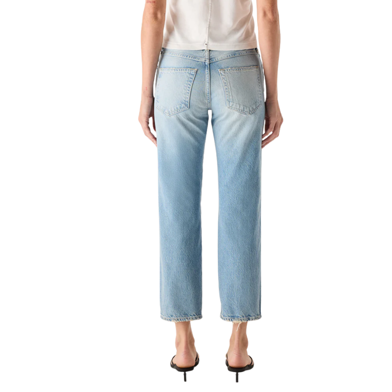 Light blue jeans worn by a person on a white background