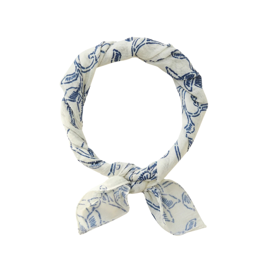 White headband with blue floral pattern on a white background