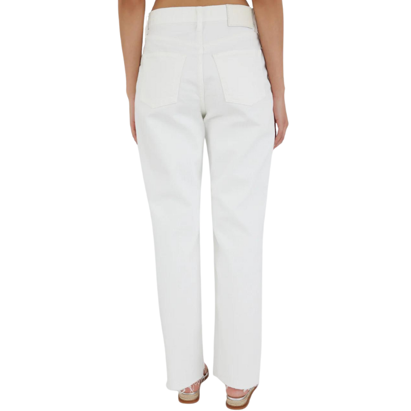 White pants worn by a person on a white background