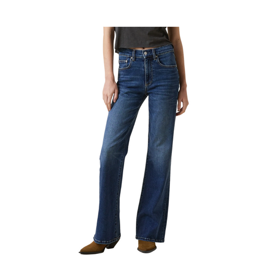 Person wearing blue jeans on a white background