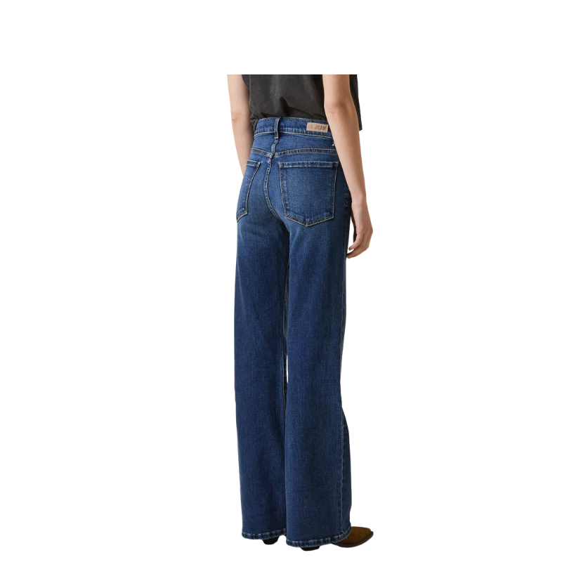 Person wearing blue jeans on a white background