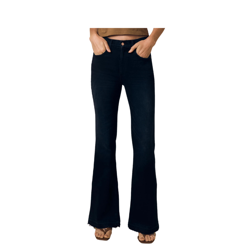 Black flared jeans worn by a person on a white background