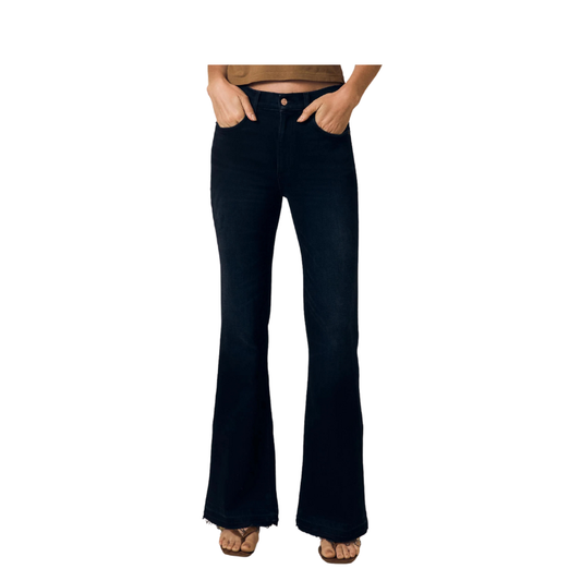 Black flared jeans worn by a person on a white background