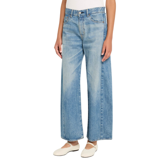 Light blue jeans worn by a person on a white background