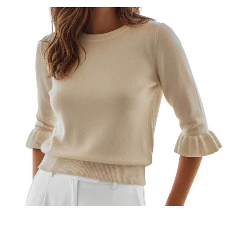 Beige sweater with ruffled sleeves worn by a person on a white background