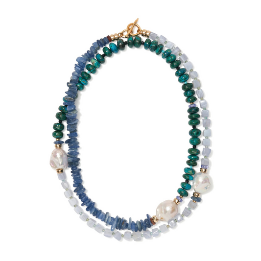 Multicolored beaded necklace with pearls on a white background
