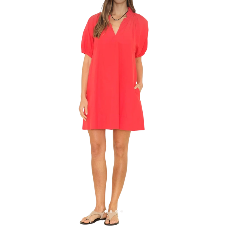 Woman wearing a red dress on a white background