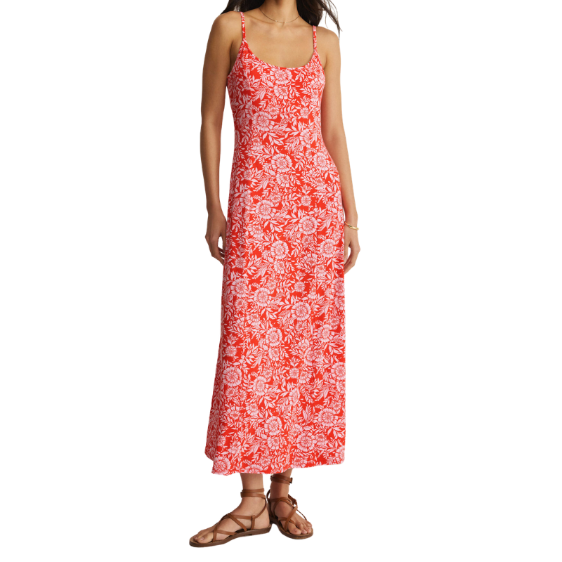 Woman wearing a red floral dress on a white background