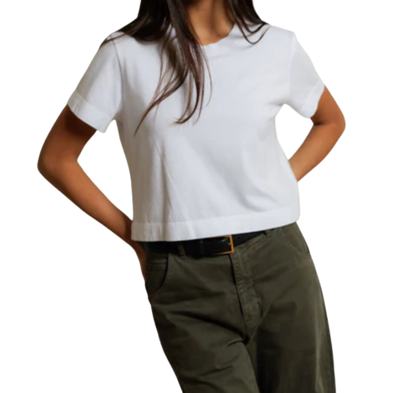 Person wearing a white t-shirt and green pants on a white background