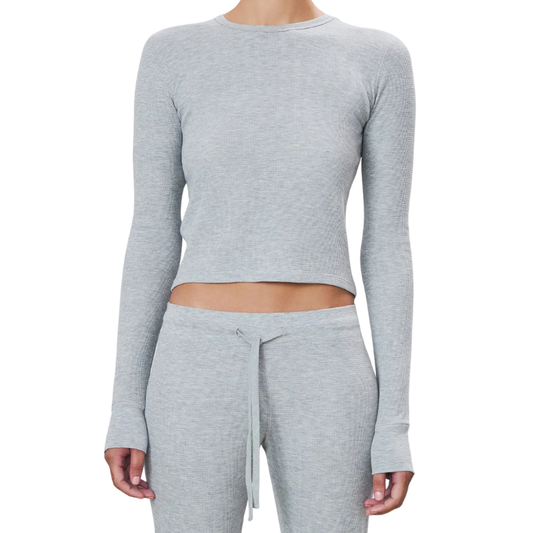 Gray long-sleeve crop top and pants set on a white background