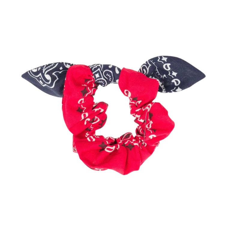 Red bandana scrunchie with black patterns on a white background