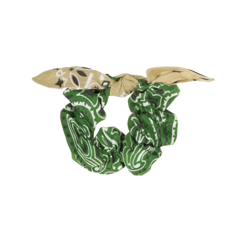 Green and beige patterned scrunchie on a white background