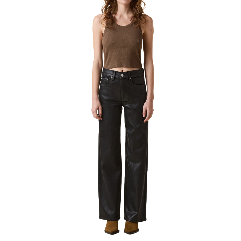 Person wearing a brown tank top and black jeans on a white background