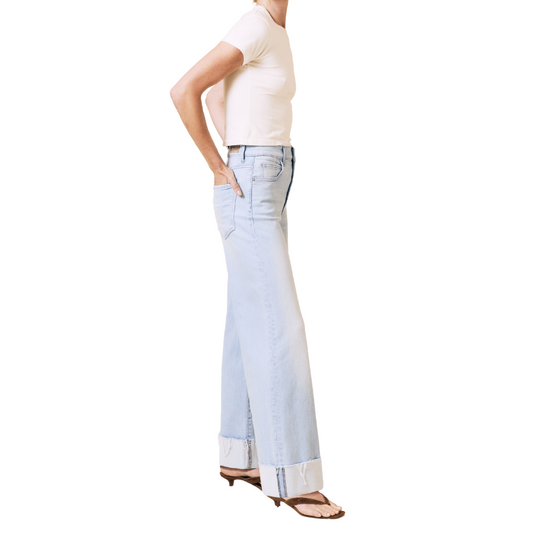 Light blue jeans worn by a person on a white background